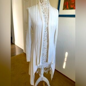 Ivory, long, light sweater. Great for over a tank top with jeans.